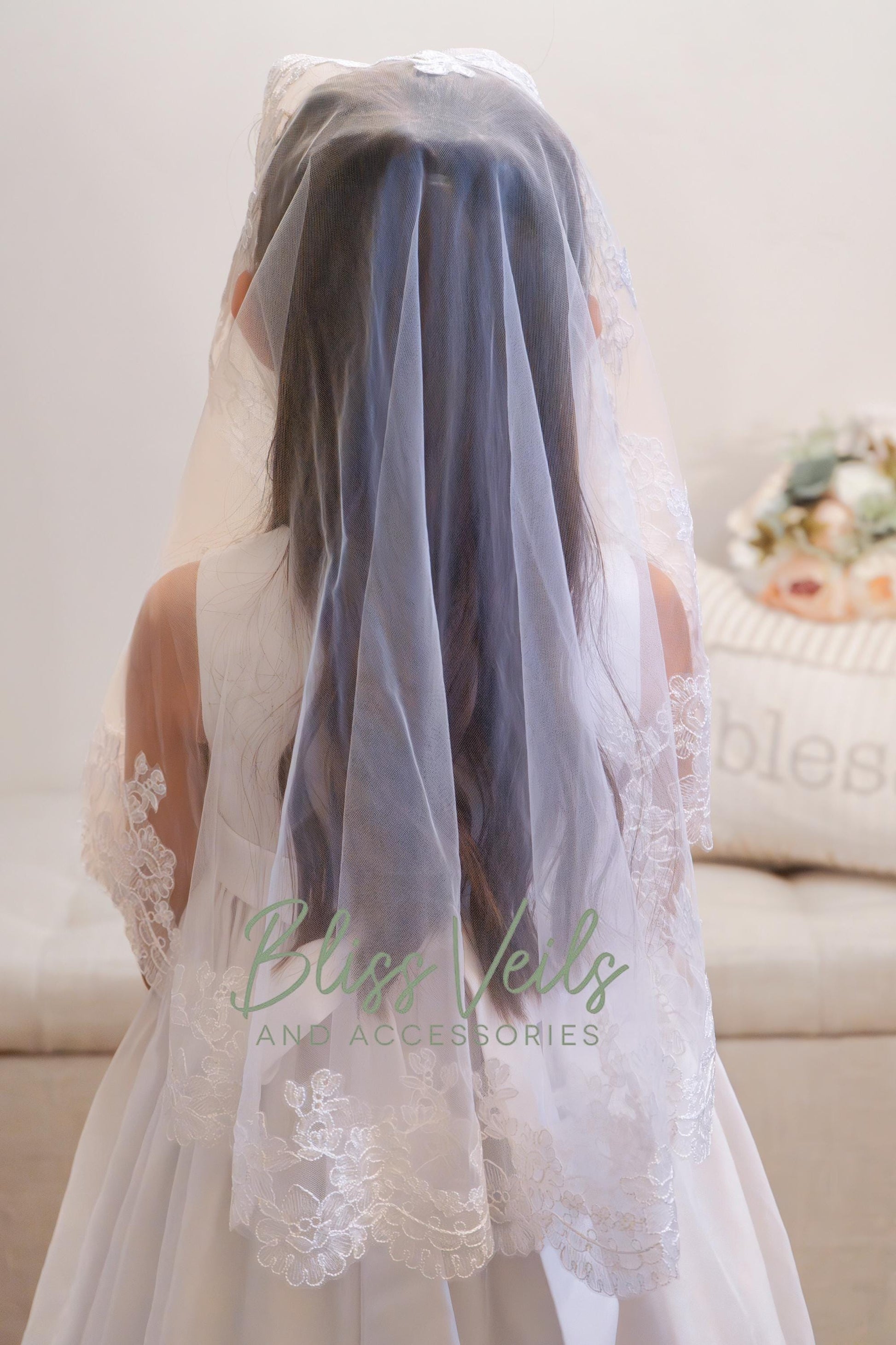 Lace mantilla First Holy Communion veil with soft tulle and delicate lace trim for a traditional Catholic ceremony