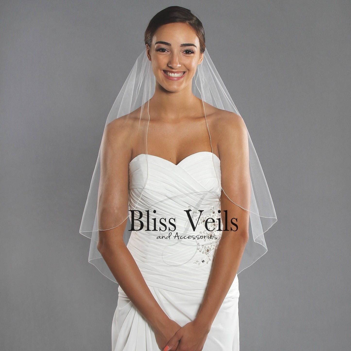 Waterfall pencil edge wedding veil in soft tulle at fingertip length