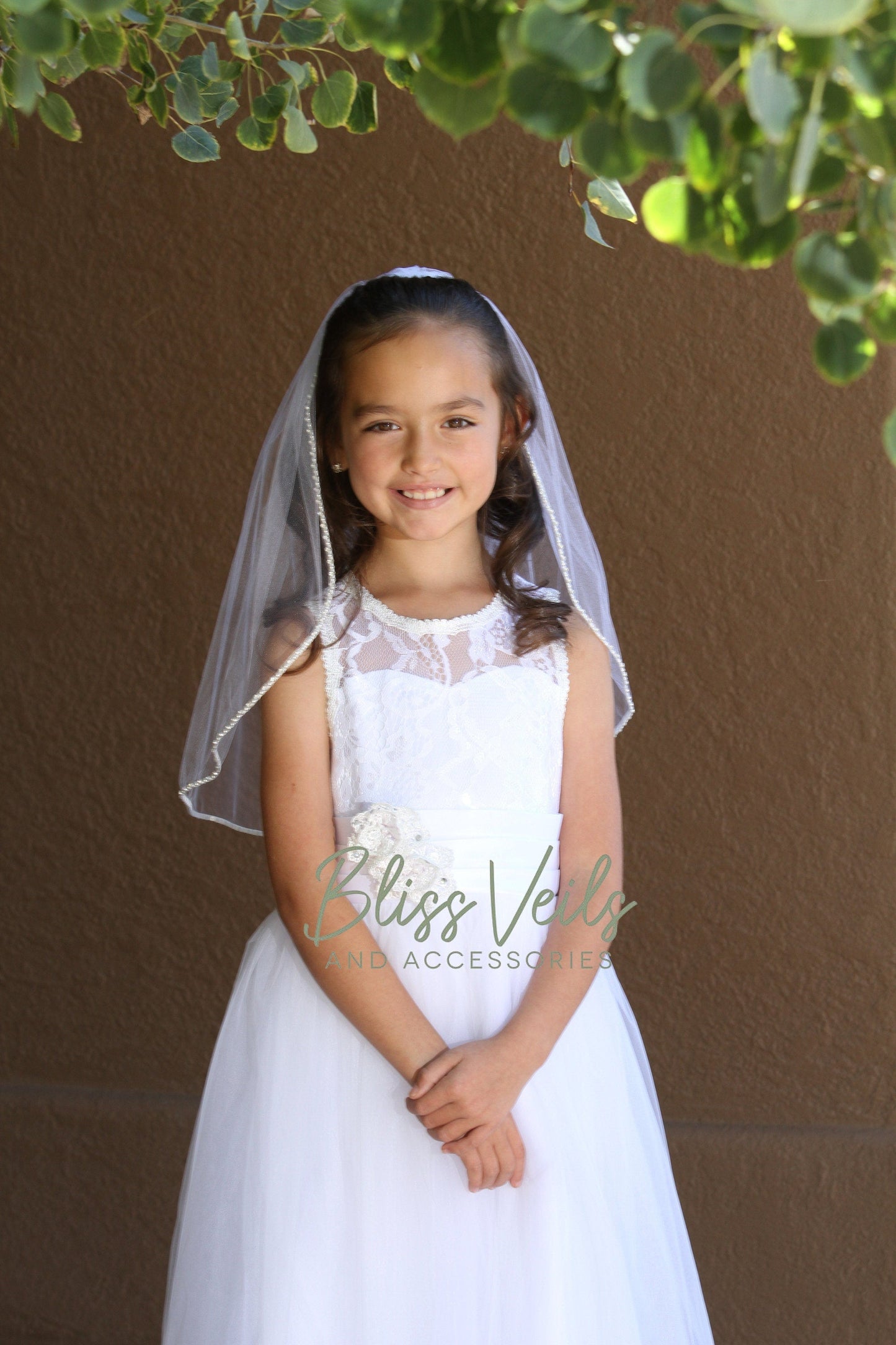 First Communion veil with pearl and rhinestone trim along the edge