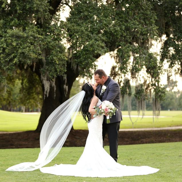 Side view of one tier sheer wedding veil with tapered shape and cut edge