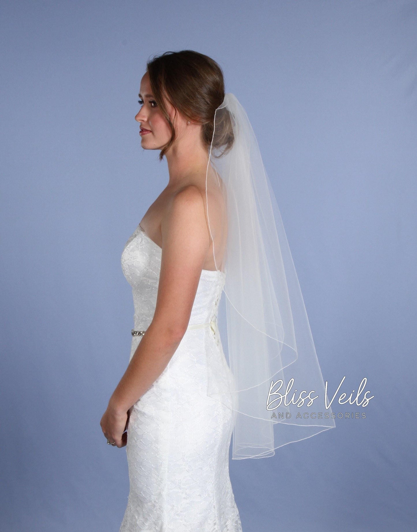 Fingertip length cascade wedding veil with pencil edge