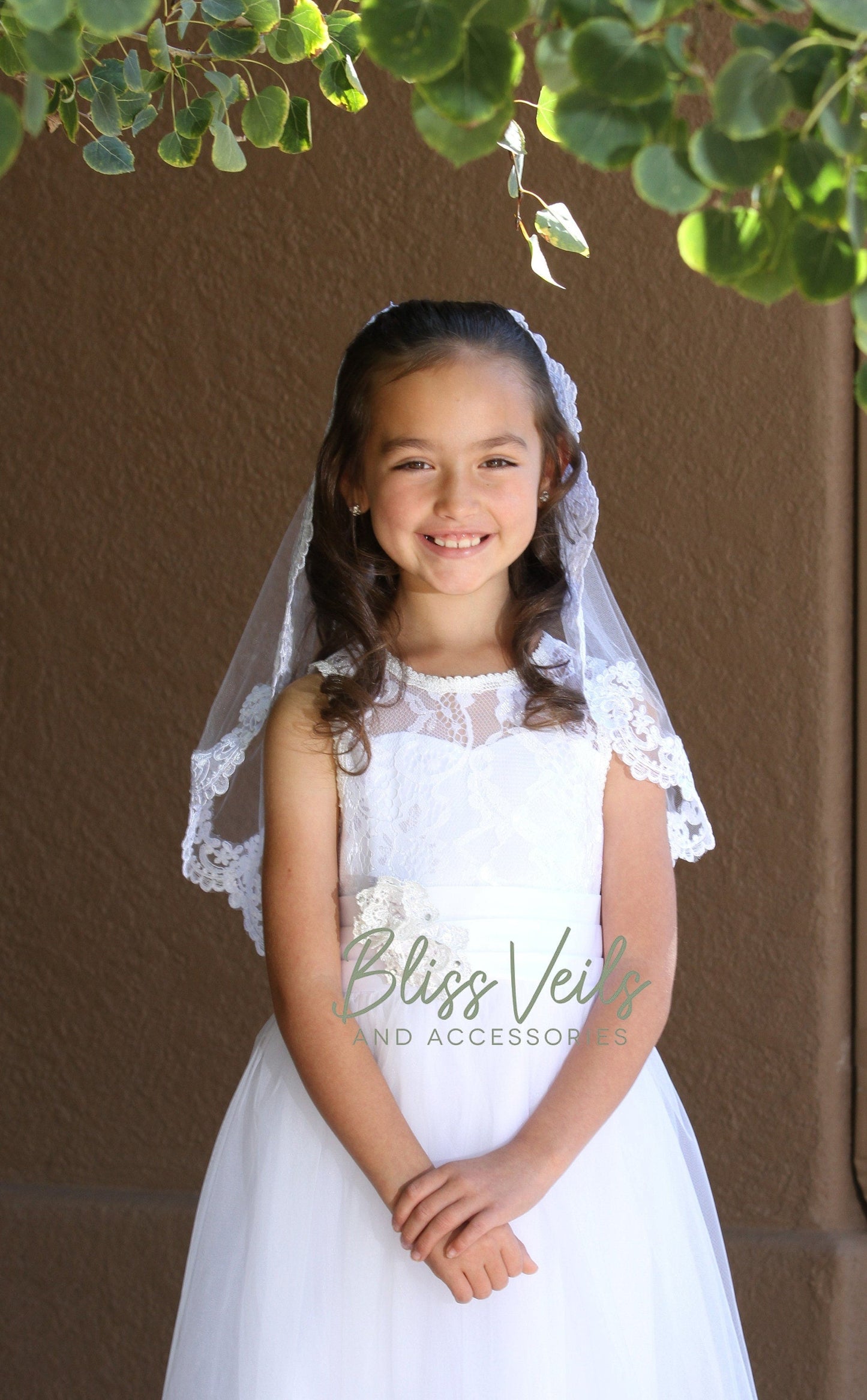 Scalloped lace First Communion veil in bright white
