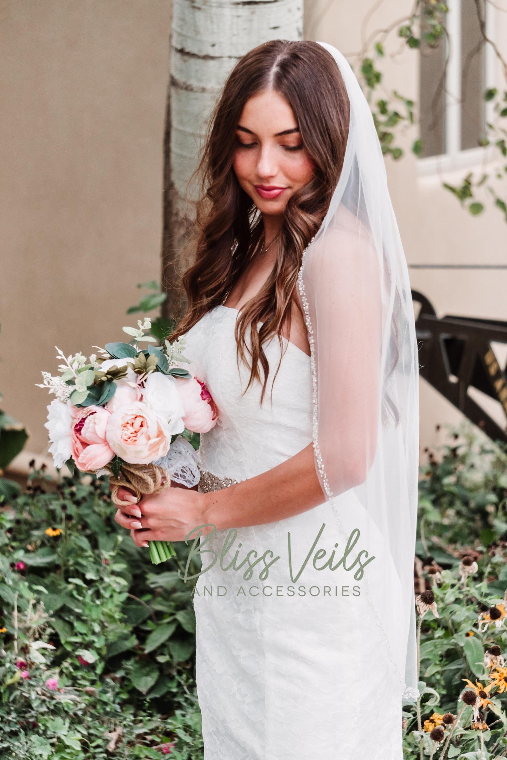 Beaded wedding veil with pearls and crystals in soft tulle