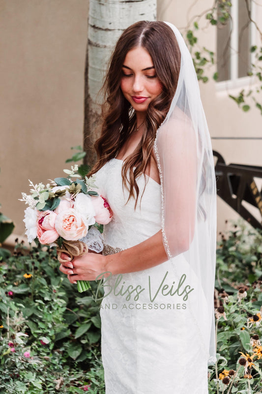 Beaded wedding veil with pearls and crystals in soft tulle