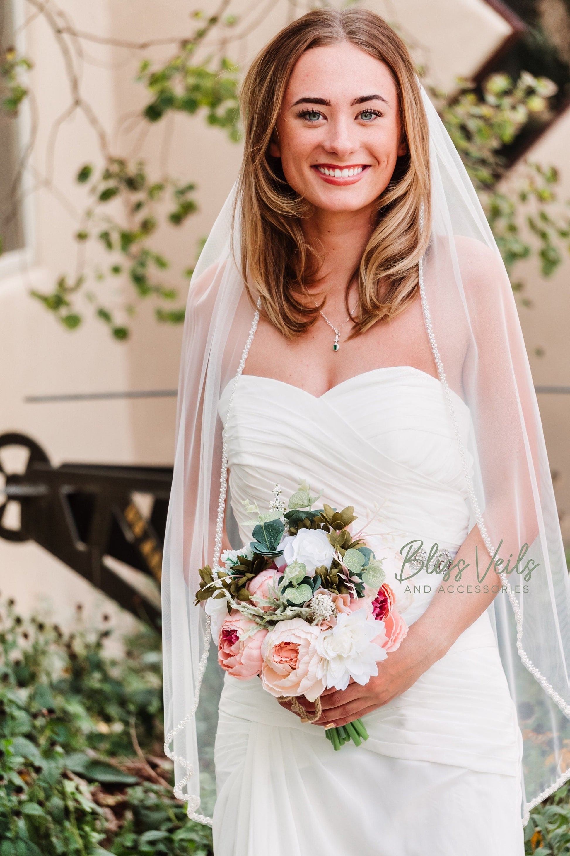 Pearl beading detail on soft tulle wedding veil