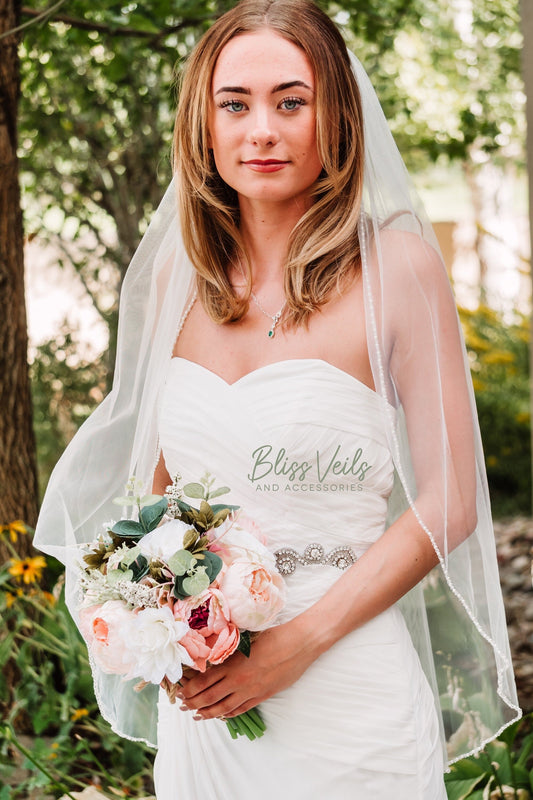 Pearl and crystal one tier wedding veil made with soft tulle