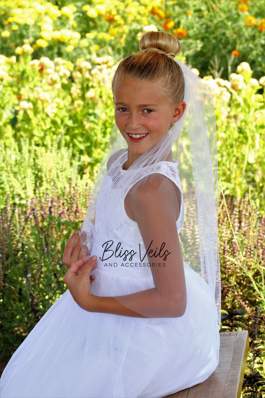 Simple First Communion veil for girls with a soft, modest design