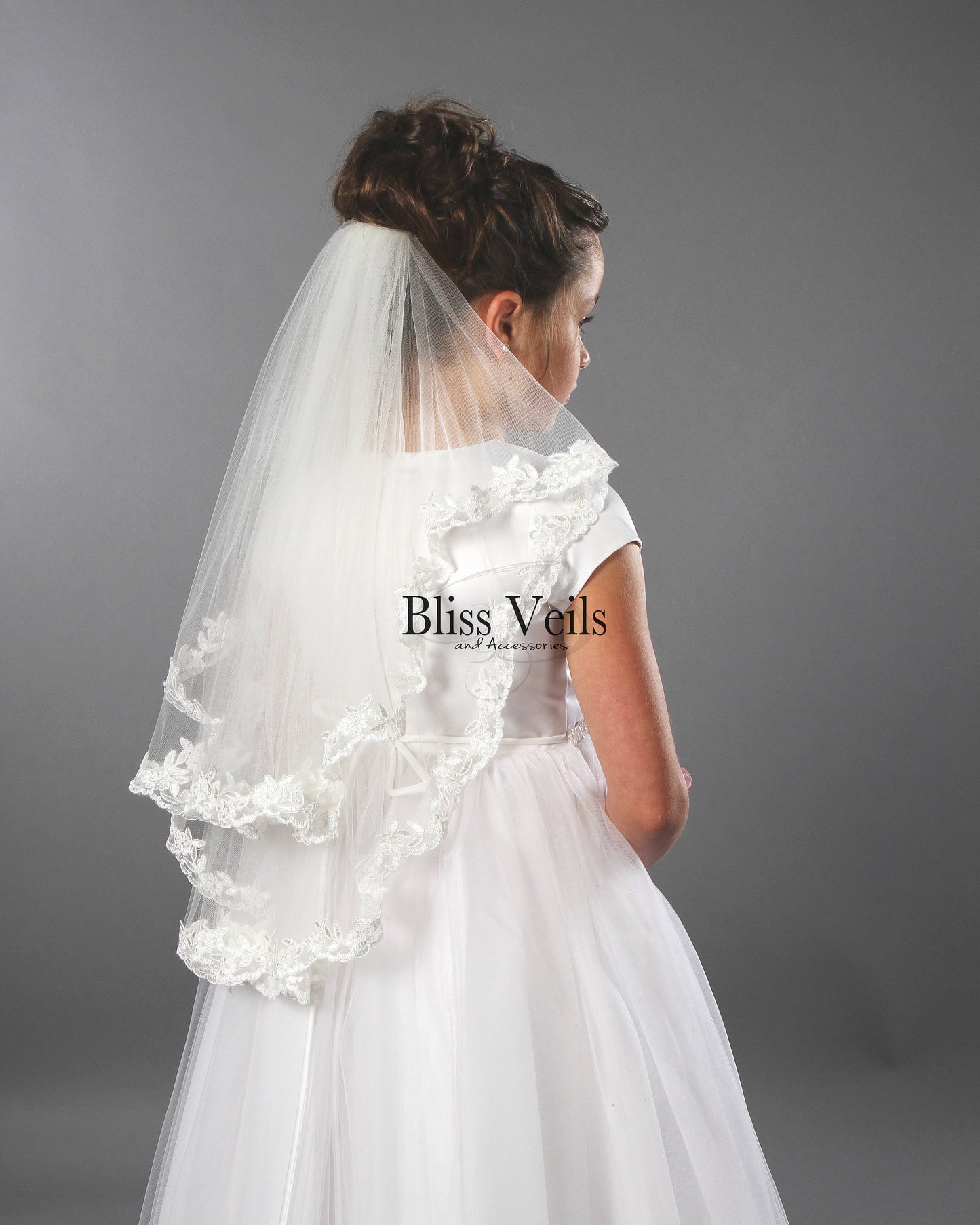Two tier First Communion veil with scalloped lace trim in bright white soft tulle