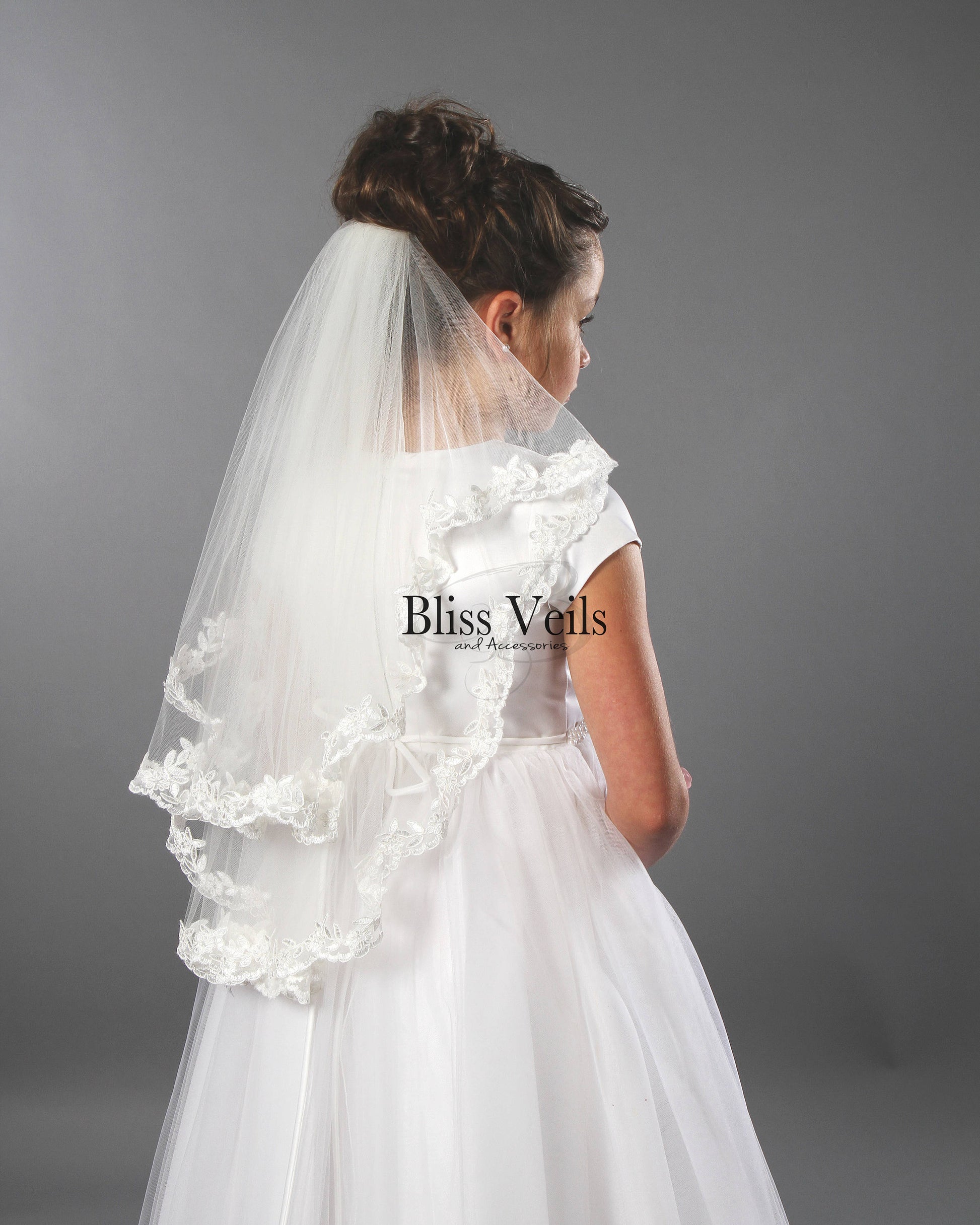 Two tier First Communion veil with scalloped lace trim in bright white soft tulle