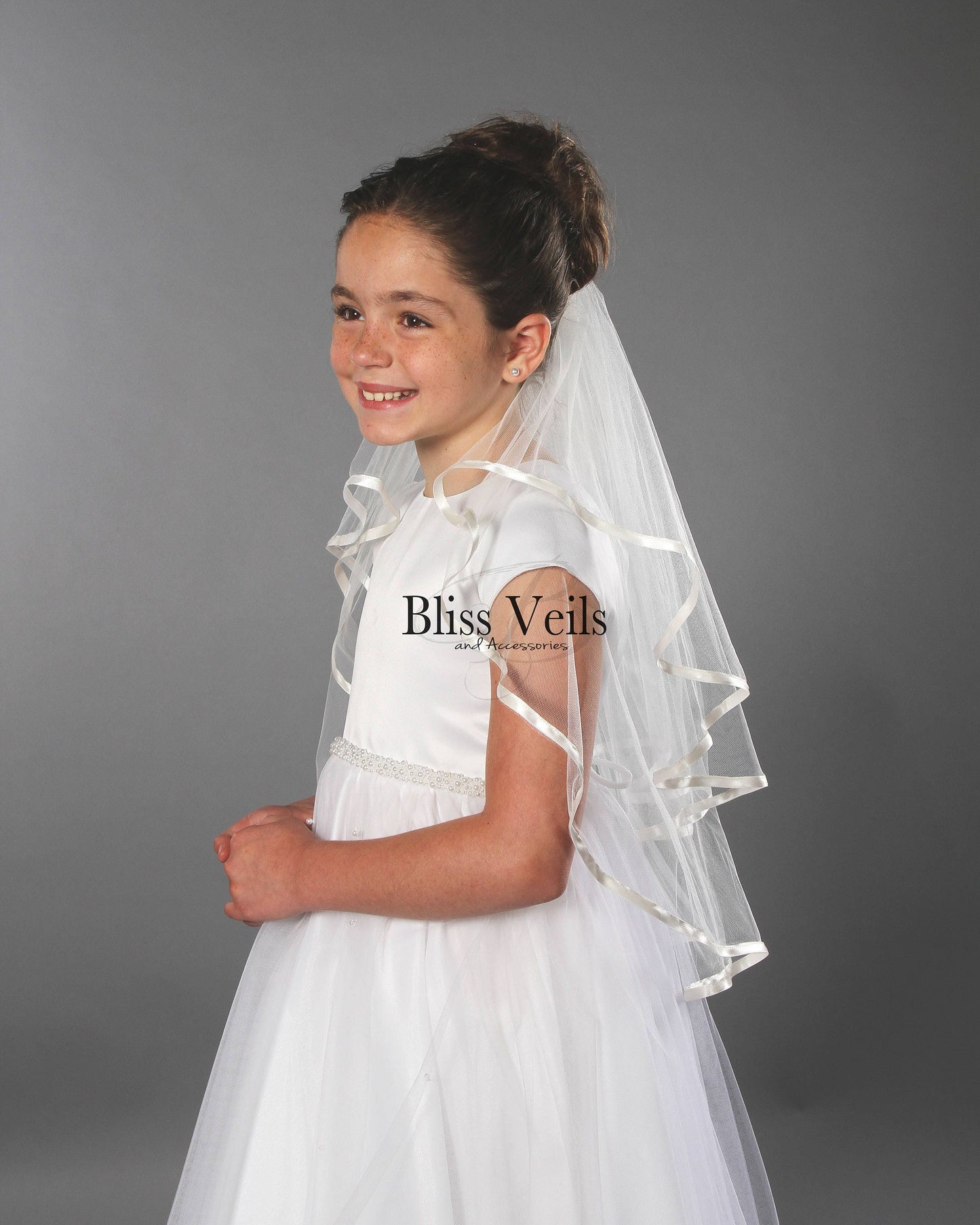Ribbon edge First Communion veil in white with a simple traditional design