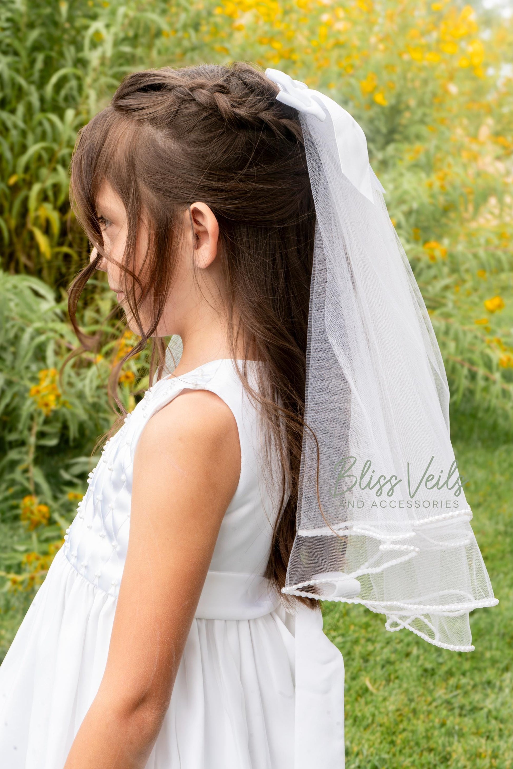 First Communion veil with pearl trim and soft bow detail