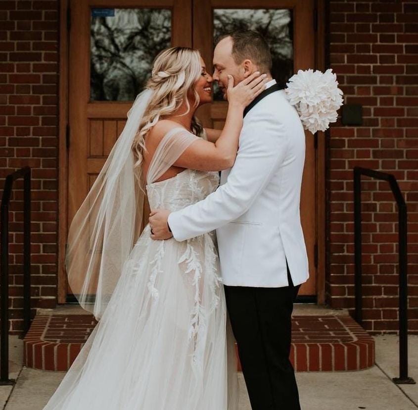 Minimalist sheer one tier wedding veil with soft tulle and a clean cut edge
