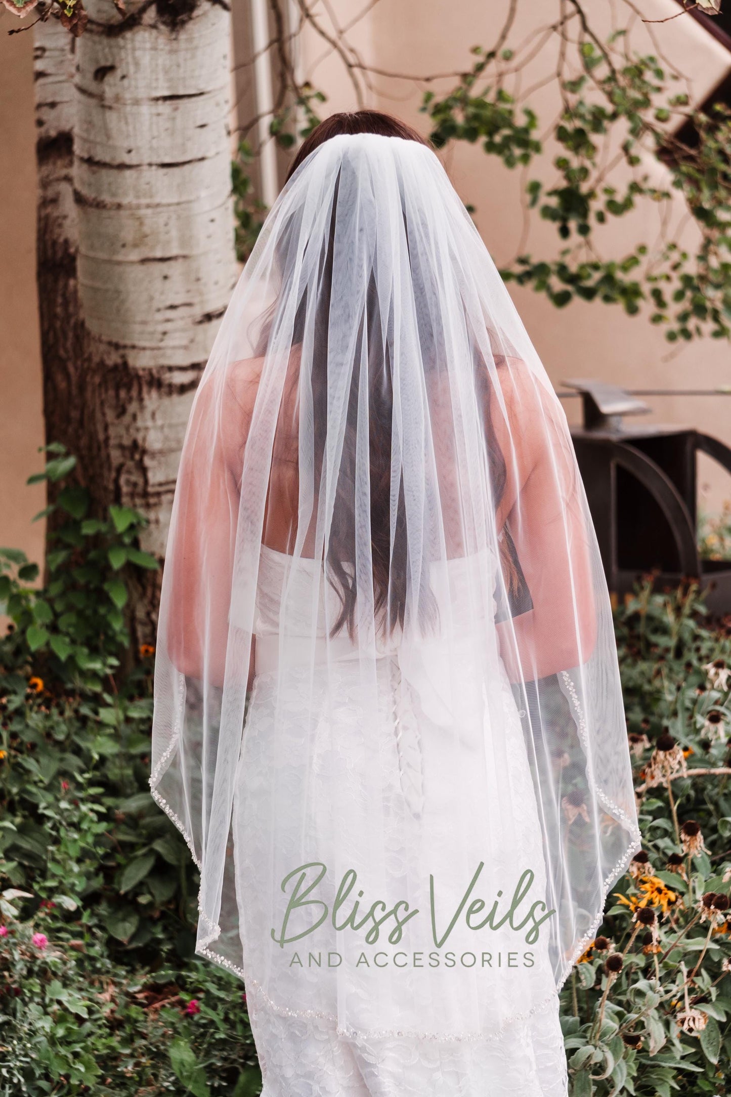 Fingertip length beaded wedding veil with pearls and crystals