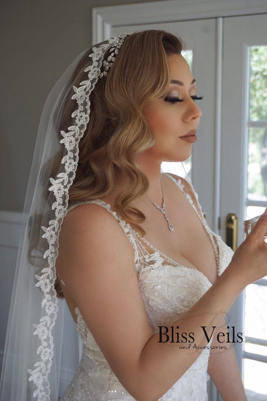 Lace mantilla wedding veil in light ivory shown in waltz length